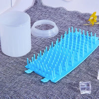 Shopify portable pet paw cleaner cup with water and brush for easy paw cleaning and hygiene.