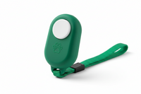 Green Shopify dog training clicker with wrist strap, used for positive reinforcement and training your dog effectively.