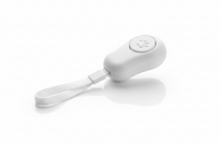 White dog training clicker with wrist strap from Shopify, used for positive reinforcement training and behavior shaping.